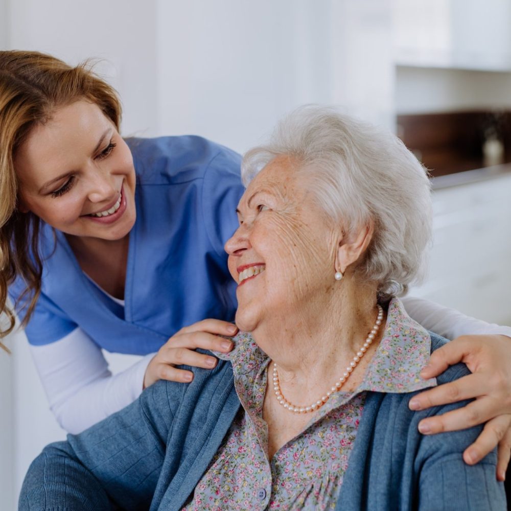 portrait-of-nurse-and-her-senior-client-on-wheelchair--e1692352267353