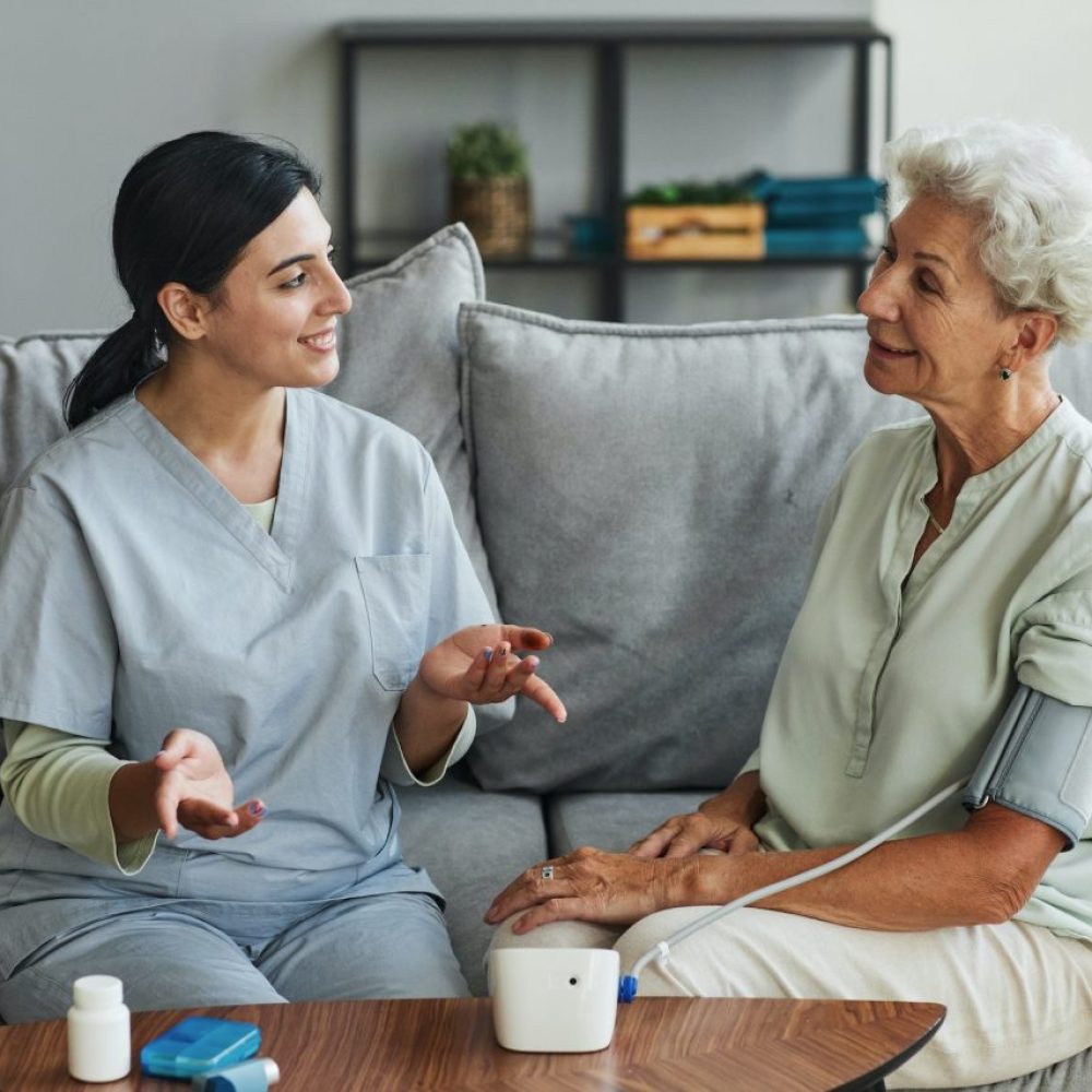 young-nurse-talking-to-senior-woman-in-retirement-home